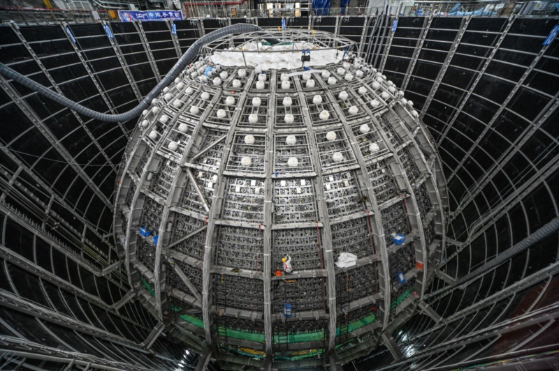 Located in Jiangmen in southern China, JUNO, a gigantic detector in the shape of a sphere 40 metres in diameter, containing 20,000 tonnes of scintillating liquid, will enable the study of still mysterious elementary particles, the neutrinos - the most abundant particles in the universe.